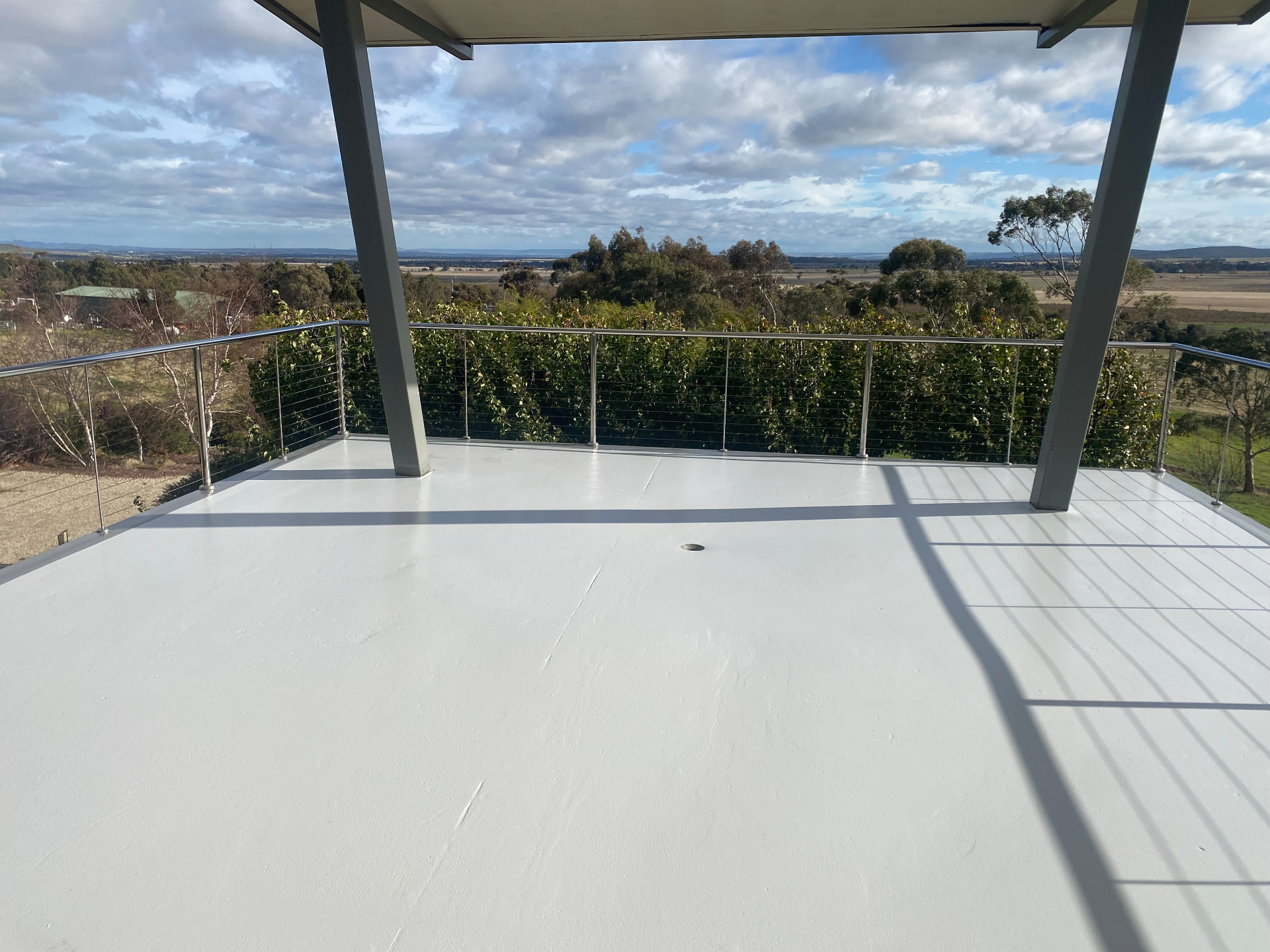 After — clean white waterproof epoxy balcony coating by ColourX